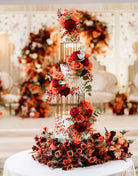 Gold birdcage metal cake separators used in a tall floral wedding cake display by Prop Options