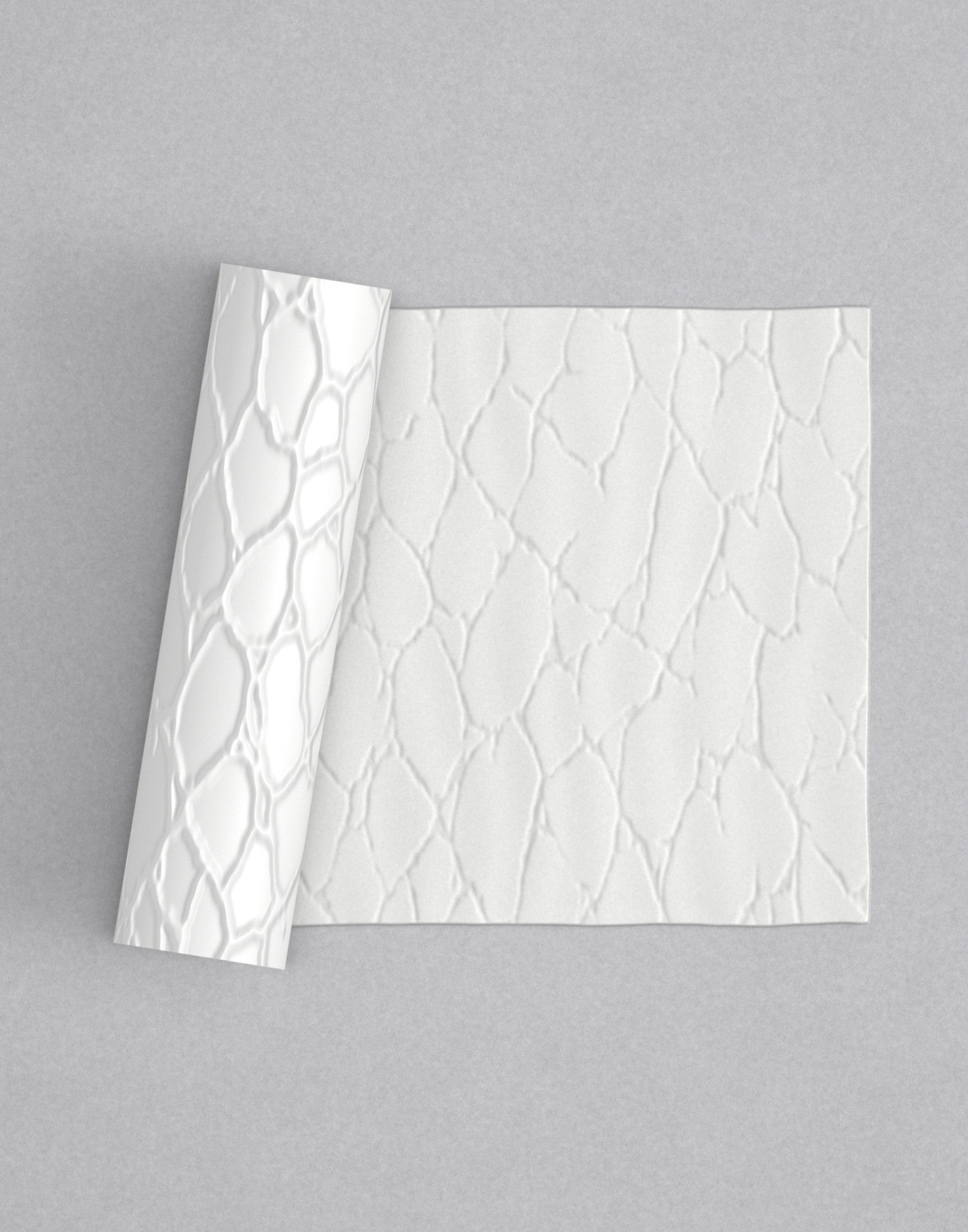 No.55 Fractura mini 4" texture rolling pin with its pattern rolled out on white fondant - Prop Options