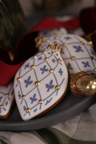Diamond bauble cookies with a blue stencilled pattern